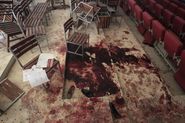 Shoes lie in Blood on the Auditorium floor at the Army Public School