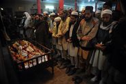 Pakistani Mourners Pray During the Funeral of a Student
