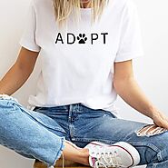 T-shirt for cat lovers, shirt shows a pet paw and the saying Adopt
