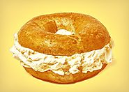 Why Do New York Bagel Places Put So Much Cream Cheese on Their Bagels? A Slate Investigation.