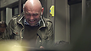 Why Coca-Cola Hired This Man to Laugh Really, Really Hard on a Crowded Subway Train
