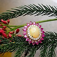 magnificent Opal and Ruby floral pattern ring in 8K Gold