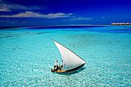 Take a boat ride on a traditional Maldivian dhoni boat.