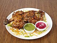 tandoori chicken with mint chutney and onion