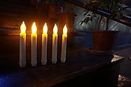 LED-Magic(TM) Set of 12 Flameless Ivory Mini Wax Dipped Flickering Amber LED Battery Timer Taper Candles