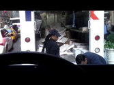 FedEx employee throwing items in truck