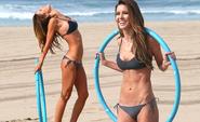 Hula girl! Audrina Patridge tones her lean bikini body with a hoop workout on the beach