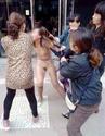SICKENING: The shocking moment 'cheating' woman is STRIPPED and BEATEN in broad daylight