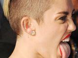 Miley Cyrus and her trademark tongue pose through the years