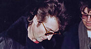 The Last Photo of John Lennon Shows Him Signing an Autograph for His Killer