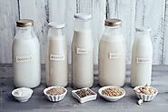 Food: Different vegan milk sorts in glass bottles por Ina Peters - Milk, Vegan - Stocksy United