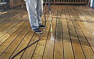 Use a pressure washer to clean the entire deck