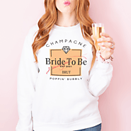 Website at https://beverthine.com/collections/unisex-sweatshirts/products/champagne-bride-bachelorette-party-shirt-un...