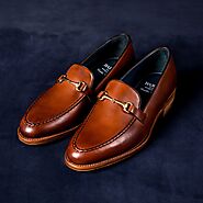 Men's black and brown loafer shoes.
