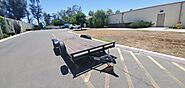 7x14 Flatbed Trailer - Wood Floor & Spare Tire | Trailer Rental Services