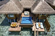 Stay in an overwater villa