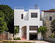Hana House: A White Riverside Residence in Vietnam