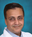 Dr Madan J
