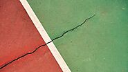 Why Do Cracks Form In My Tennis Court?