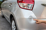 What are the important factors to check while going to an auto body repair shop?