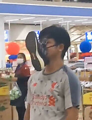 Man in taiwan was seen queuing at a store with a shoe on his face - Oddly Interesting