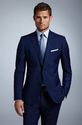 Blue Suit. Light Blue Tie.