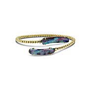 Boulder Opal Bangle set in 18k displaying Ocean Flashes of Red, Blue and Green