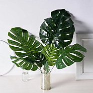 Website at https://www.tuilly.com/view-product/1646388052/6-Stems-Green-Monstera-Leaf-Stem,-Fake-Tropical-Plant-Artif...