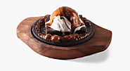 Website at https://vegrecipeswithvaishali.com/sizzling-brownie-with-ice-cream/