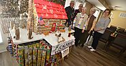 (WATCH) The art of food: Warsaw senior citizens create canned food sculpture for area food pantries