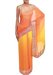 Yellow and orange shaded saree adorn in kundan embroidery