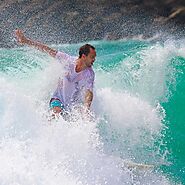 Surfing Against the Splashing Waves