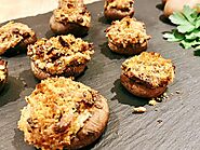 Website at https://2dadswithbaggage.com/recipe-for-stuffed-mushrooms-with-cracker-crust/