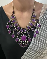 Website at https://vintarust.com/products/afghan-tribal-stone-bib-necklace