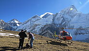 Who leads the Everest base camp helicopter tour and are they well trained and experienced?