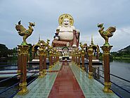 Visit the smiling Big Buddha at Wat Plai Laem