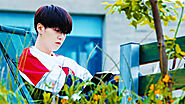 suga relaxing while reading a book