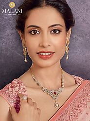 Experience the timeless elegance of the Malani Jewelers diamond pendant necklace set