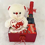 Cute Valentines Day gift box for your girlfriend with special chocolates, a teddy bear, and more