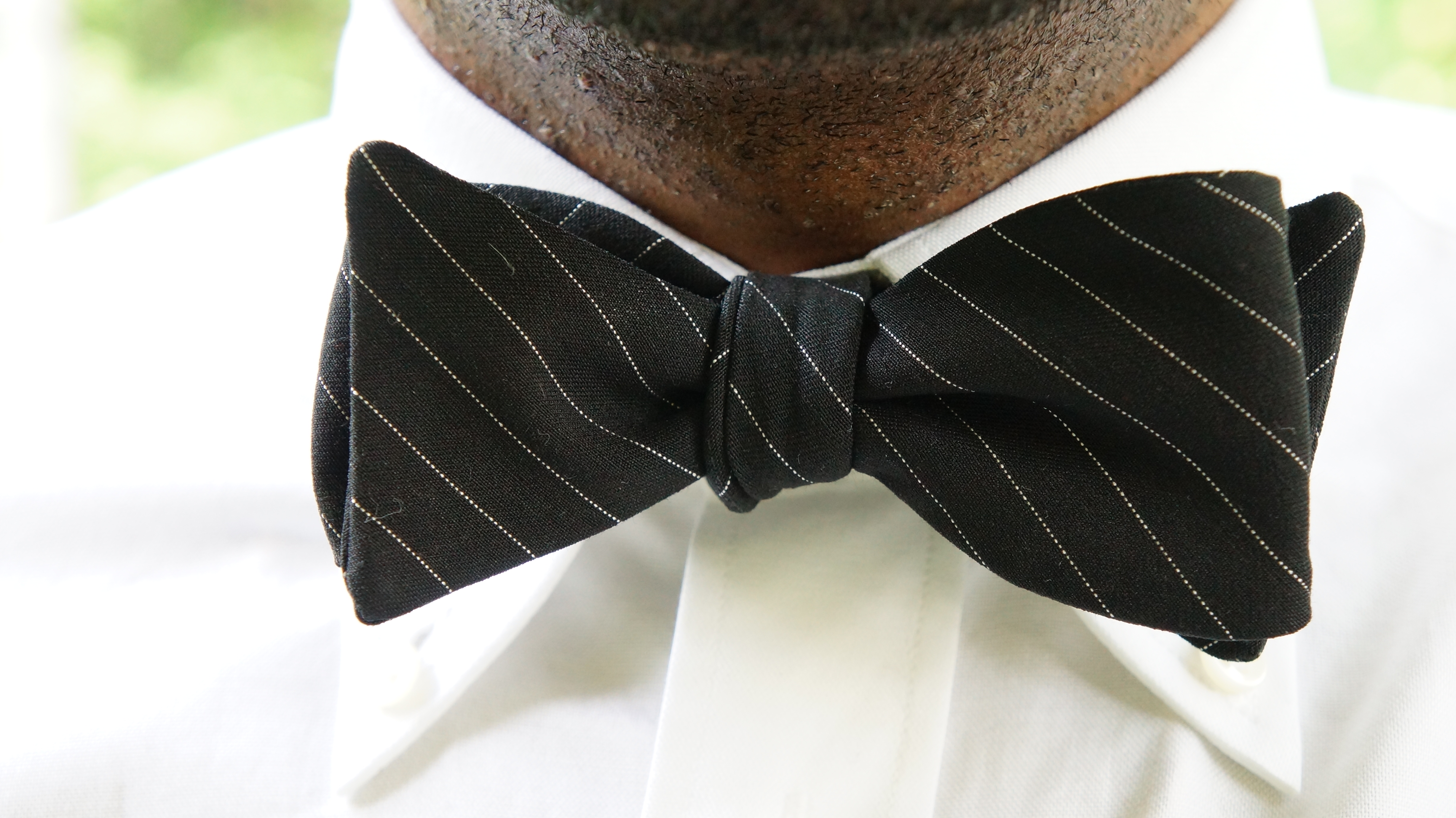 Headline for The Bow Tie Naming Rights Contest (Black Pinstripe)