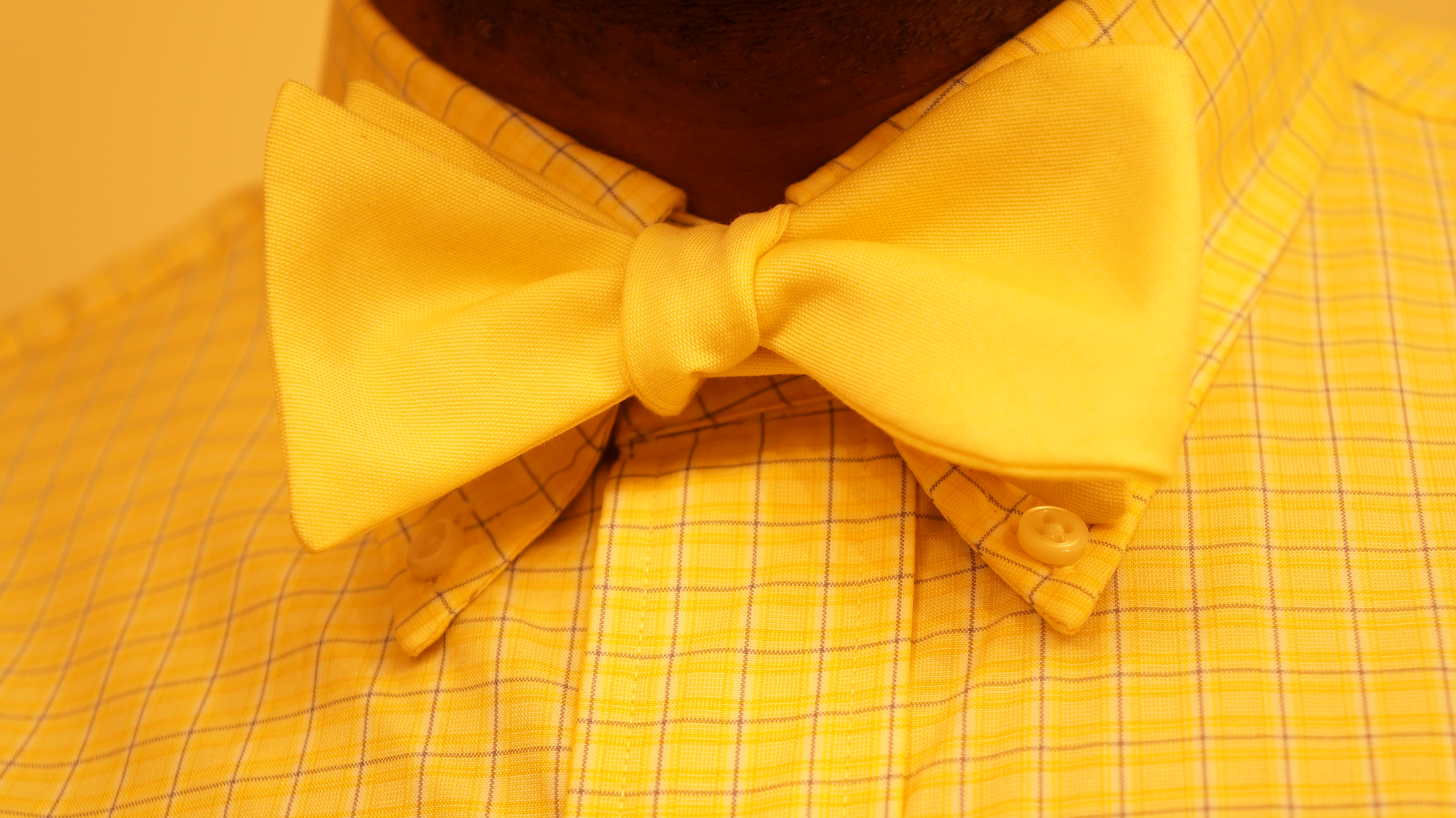 Headline for The Bow Tie Naming Rights Contest (Charity Water Yellow)
