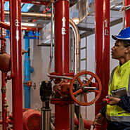 Can a fire suppression engineer inspect and test sprinkler systems?