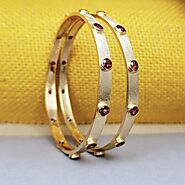 Garnet studded pair of Bangles in 18K Frosted Gold