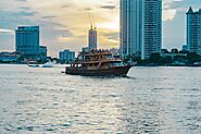 Riverside Scenes of Boats and Local Life along the Chao Phraya River