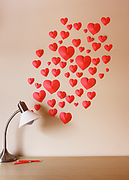 Make a wall of paper hearts | How About Orange