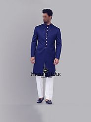 Dark blue jamawar groom sherwani design with golden buttons