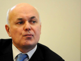 Iain Duncan Smith defends universal credit after damning report