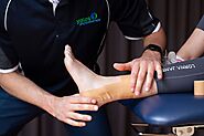 A professional sports physiotherapist in Adelaide providing effective treatment for a sprained ankle at a trusted spo...