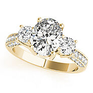 Yellow gold Oval Three-Stone Diamond Ring with Pavé Band and Four-Prong Setting