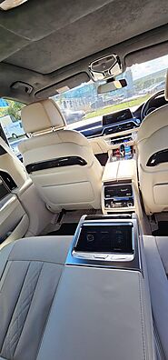 BMW sedan interior featuring premium leather seats, get amazing travel experience with Sublime Chauffeur.